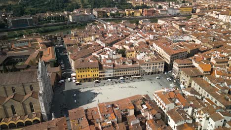 Aerial-orbit-above-courtyard-at-front-of-Basilica-of-Santa-Croce-in-Florence-Italy
