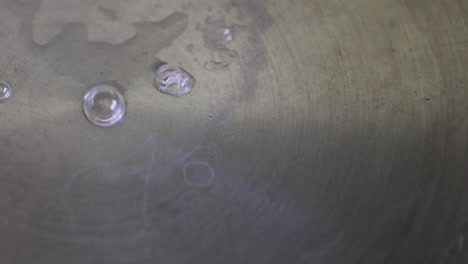 Close-Up-view-of-bubbles-forming-on-the-surface-of-a-stainless-steel-pan