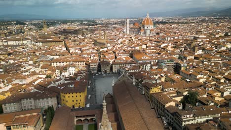 Aerial-pullback-above-Basilica-of-Santa-Croce-in-Florence-Italy-as-cloud-shadow-passes-over-building