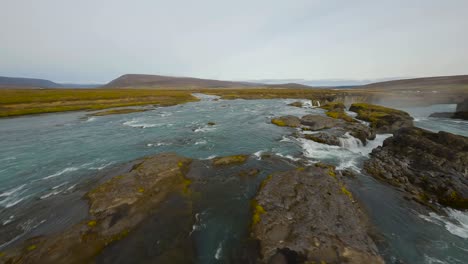 Aerial-view-with-FPV-drone-of-Kirkjufellsfoss-waterfall-in-Iceland