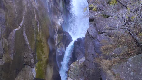 Waterfall-in-between-rocks-falling-in-slow-motion