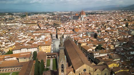 Drone-push-in-from-backside-of-Basilica-of-Santa-Croce-in-Florence-Italy-as-cloud-shadow-passes-over