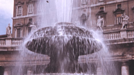 Tourists-in-Piazza-San-Pietro-next-to-Fontana-del-Bernini-in-Rome-in-1960s
