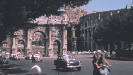 Via-dei-Fori-Imperiali-in-front-of-Triumphal-Arch-of-Constantine-in-Rome-1960s