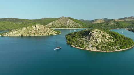 Drone-dolley-shot-over-luxe-sailing-yacht-in-Telašćica-national-park-on-a-sunny-day