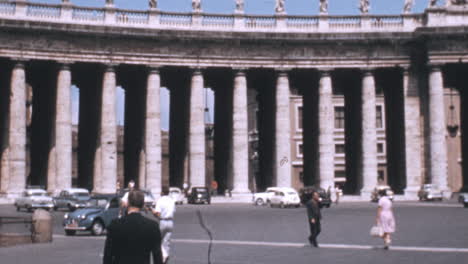 Tourists-with-Colonnade-in-Saint-Peters-Square-in-Background-in-Rome-in-1960s