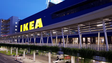 Shoppers-passing-by-the-world-famous-furniture-shop-Ikea-located-in-Bangkok,-Thailand