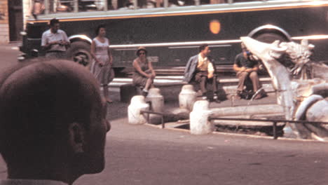 Tourists-and-Locals-Relaxing-Around-Fontana-della-Barcaccia-in-Rome-1960s