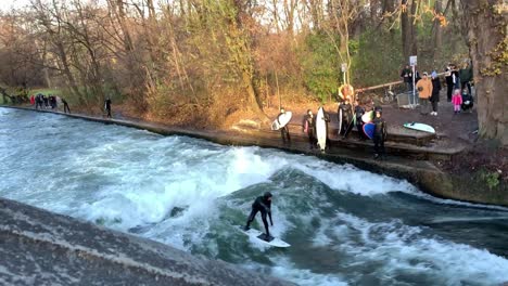 Male-surfer-at-Eisbach-river-stream-Munich-standing-wave-surfing