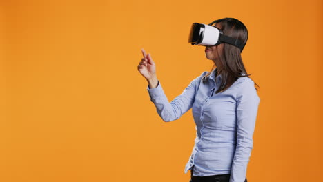 Asian-woman-operates-virtual-reality-headset-on-camera