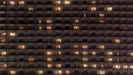 Time-lapse-front-view-of-building-with-switching-on-and-off-lights-in-the-windows-Hong-Kong-China