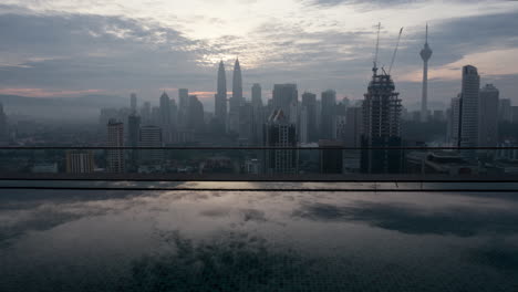 Timelapse-of-Kuala-Lumpur-city-view-from-rooftop-pool