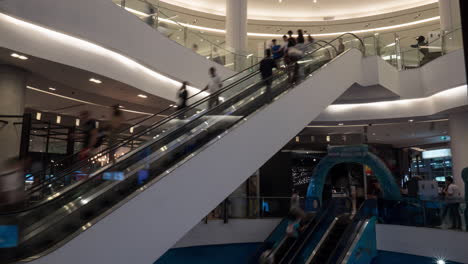 Timelapse-of-people-on-escalators-in-trade-centre