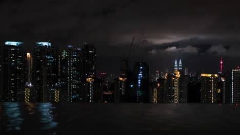 Timelapse-of-night-Kuala-Lumpur-view-from-rooftop-pool