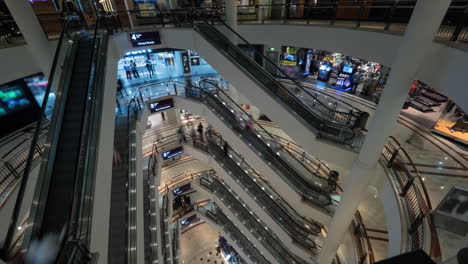 Timelapse-of-people-on-escalators-in-multistorey-shopping-mall