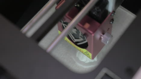 Top-close-up-view-of-mechanism-of-3d-printer-in-process