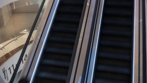 Timelapse-of-escalators-with-people-in-trade-centre
