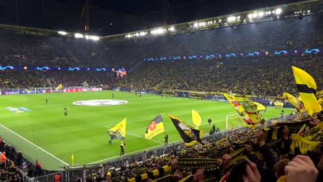 Slow-motion-shot-showing-crowd-of-soccer-fans-celebrating-champions-league-game-of-borussia-dortmund-in-stadium