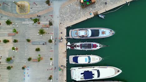 Smooth-aerial-top-view-flight-Harbor-promenade-Ibiza-Town-Spain