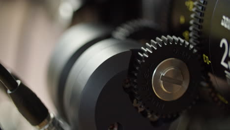 Close-up-shot-of-the-gear-of-a-focus-motor-attached-to-a-cinema-lens