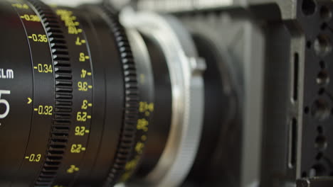 Medium-close-up-shot-of-a-cinema-lens-with-moving-focus-barrel