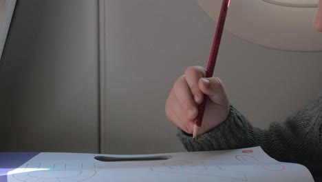 Close-up-view-of-small-boy-learning-to-writing-with-pencil