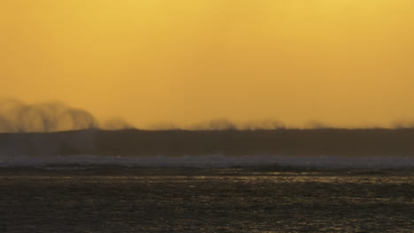 Ocean-view-with-crushing-waves-at-sunset