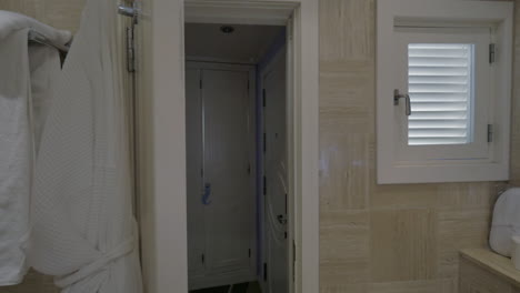 Closing-bathroom-door-in-the-hotel