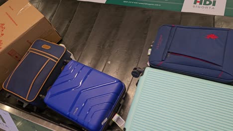 Closeup-shot-of-luggages-on-a-baggage-claim-counter