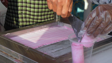 Making-cold-rolled-ice-cream-at-a-street-stand