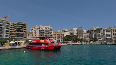 Touristic-boat-in-port-harbour-of-Valletta,-Malta-on-the-Mediterranean-Sea