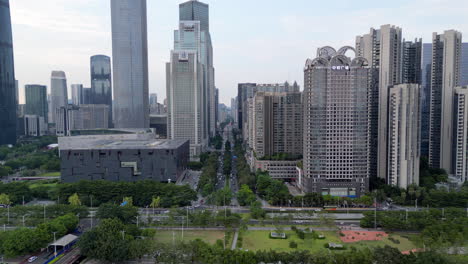 GUANGZHOU-DOWNTOWN-CITY-MID-AFTERNOON-DRONE-TRACK-IN