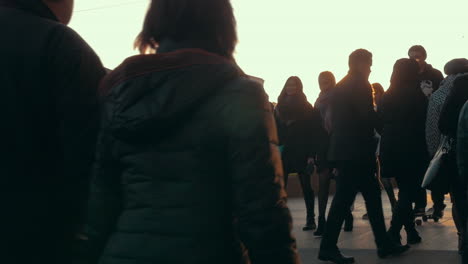 Anonymous-crowd-walking-at-sunset-slow-motion