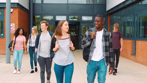 Group-Of-Students-Walking-Outside-College-Buildings