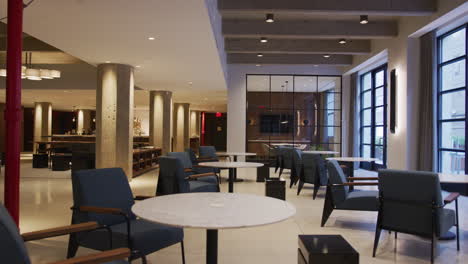 Tables-and-chairs-in-empty-furnished-business-lobby-interior