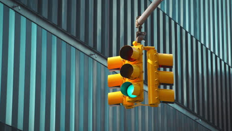Close-Up-Of-Traffic-Lights-Above-Road-Junction-In-New-York