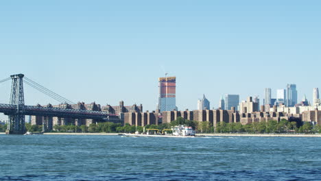 Ship-On-Hudson-River-With-Skyline-And-Williamsburg-Bridge