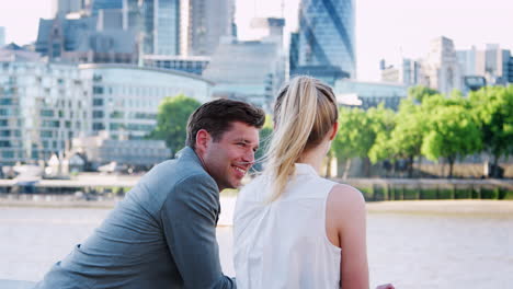 Businesspeople-Standing-By-River-Thames-And-London-City-Skyline