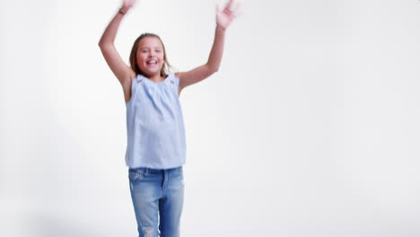 Young-Girl-Dancing-Against-White-Background-In-Slow-Motion