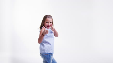 Girl-Jumping-And-Posing-Against-White-Studio-Background