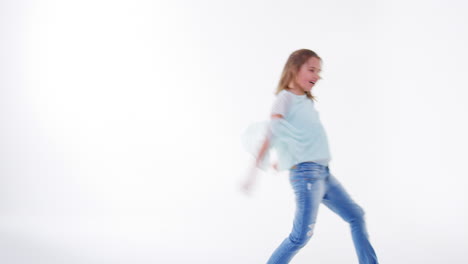 Young-Girl-Running-And-Jumping-Against-White-Background
