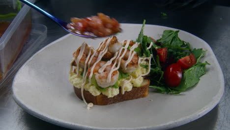 The-Chef-Puts-Tomato-Jam-on-Toast-with-Scrambled-Eggs-Avocado-and-Fried-Shrimp