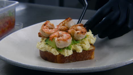The-Chef-Puts-Fried-Shrimp-on-Toasted-Bread-with-Scrambled-Eggs