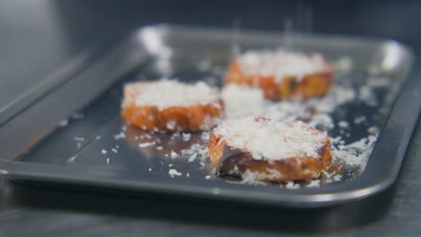Process-of-Sprinkling-Grated-Cheese-on-Baked-Sweet-Potato