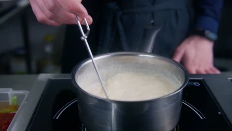 Chef-Cook-Mixing-Cream-Sauce-By-Spiral-Whisk