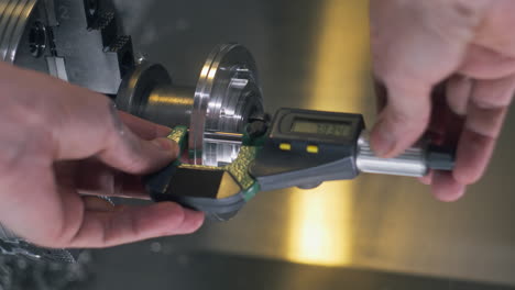 Technician-Makes-Measures-By-Electrical-Micrometer