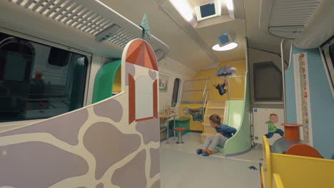 Boy-having-fun-in-the-train-play-space