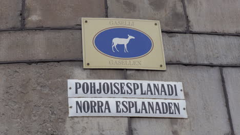 Sign-with-street-name-and-gazelle-picture-in-Helsinki-Finland