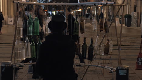 Street-musician-playing-on-glass-bottles