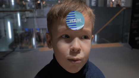 Funny-kid-with-HAM-sticker-on-the-forehead